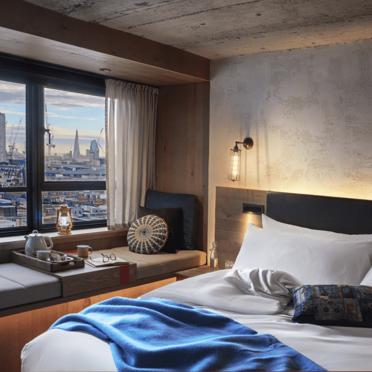 hotel room with a king bed and window bench