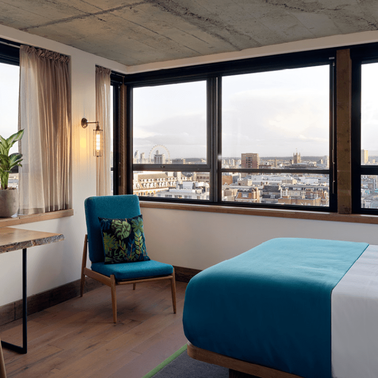 hotel room with seating area and workspace