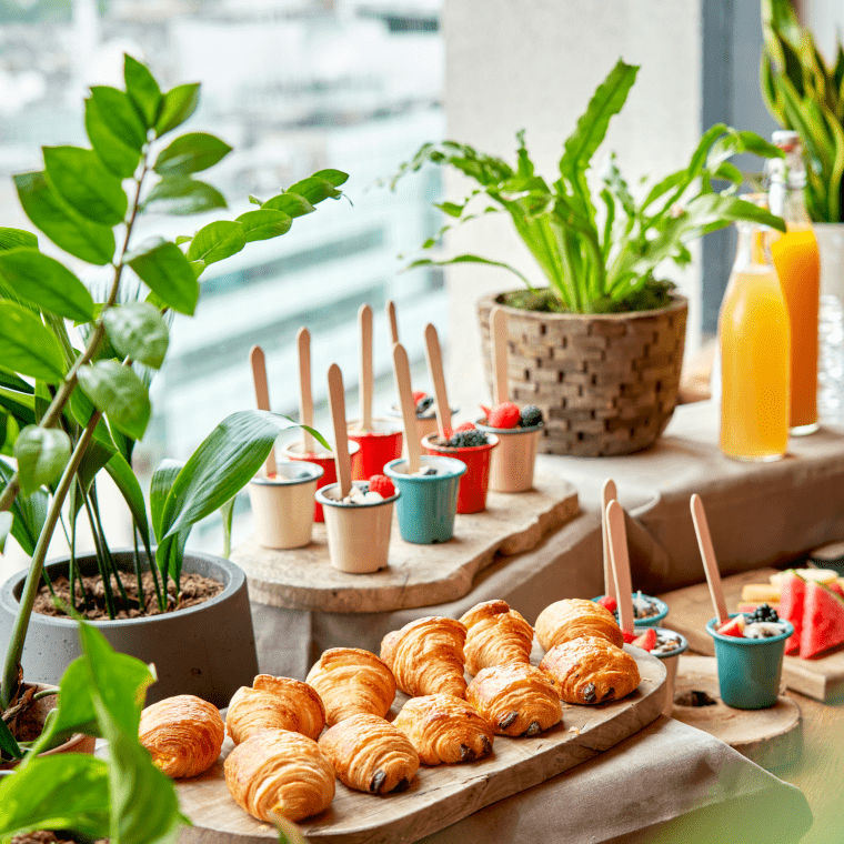 A spread of croissants, yogurt cups for a breakfast event at Treehouse.