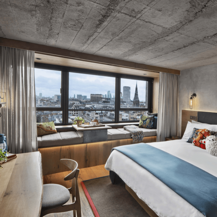 hotel room with king bed and wood desk