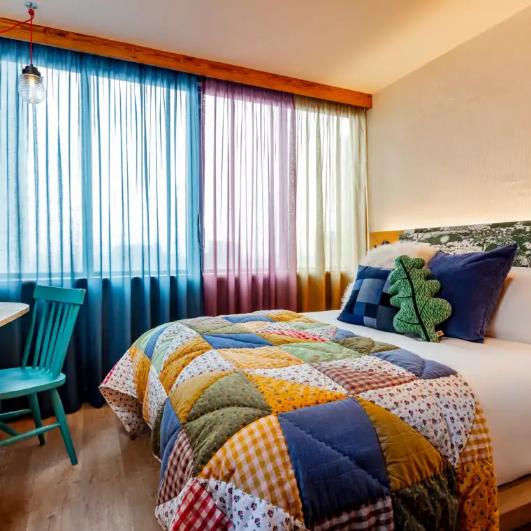 A colourful guest room at Treehouse Manchester