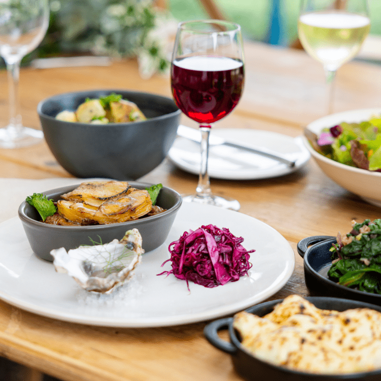 Plate of food and a glass of wine