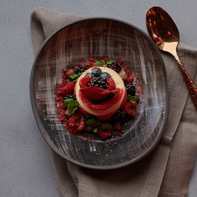 A desset with berry garnish.
