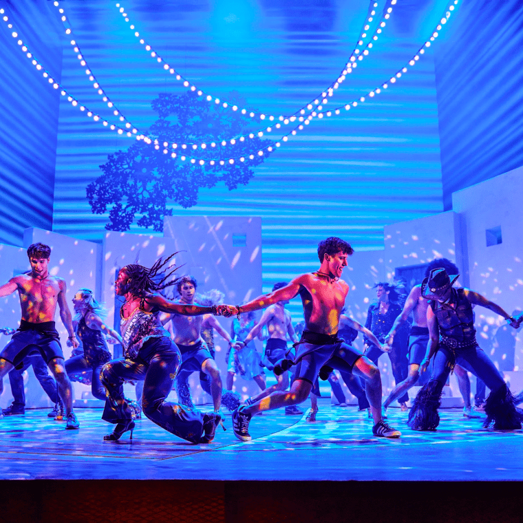 people on a stage dancing
