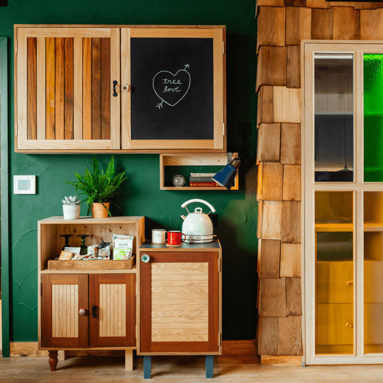 Hotel room with green walls and wood decor