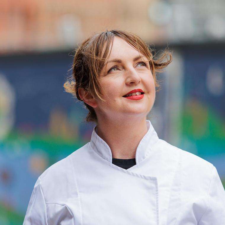 Chef Mary-Ellen McTague in her chef's coat staring at the sky