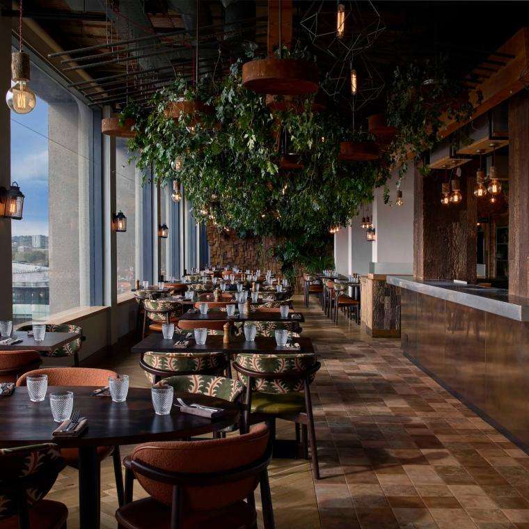 Dining wooden tables at Madera