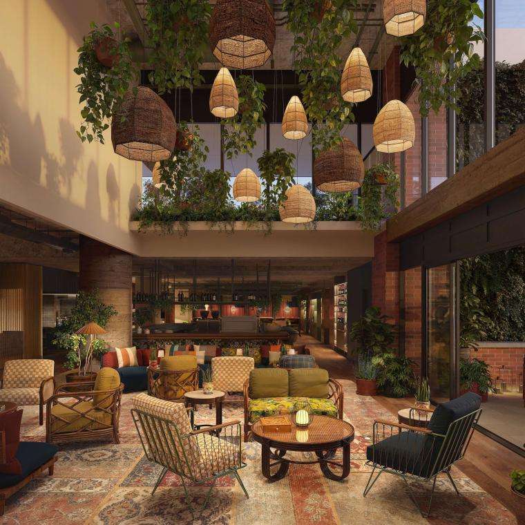 Hotel lobby featuring modern furniture, decorative plants, and a welcoming atmosphere for guests.