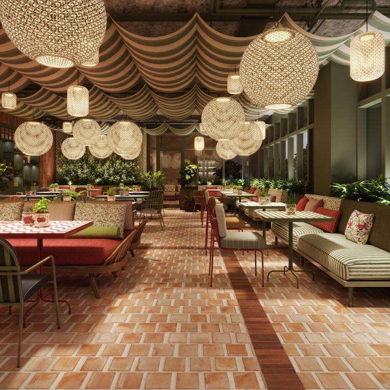 A cozy restaurant featuring a brick floor and an abundance of lush green plants throughout the space.