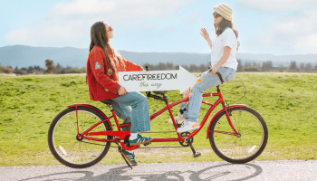 two girls on tandem bike