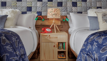 hotel room with two beds that share a nightside table