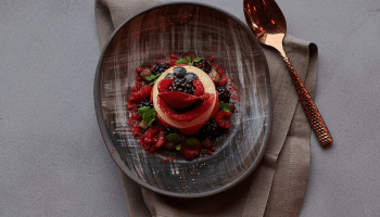 A desset with berry garnish.