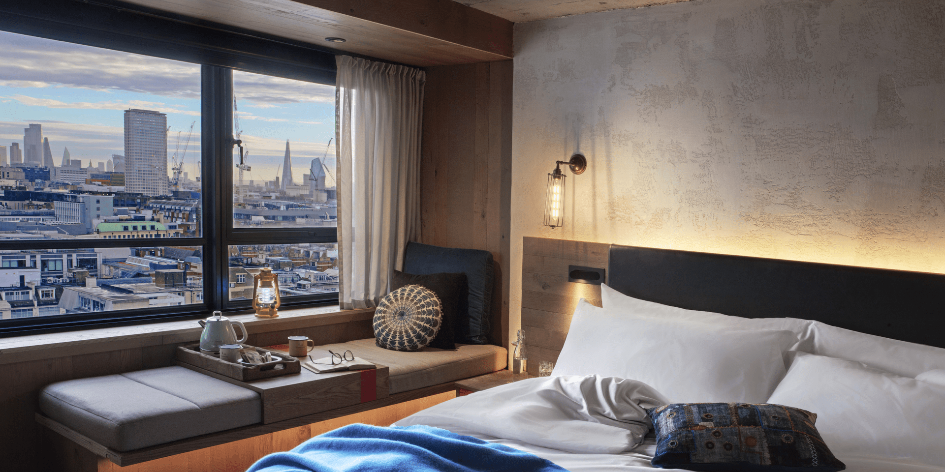 hotel room with a king bed and window bench