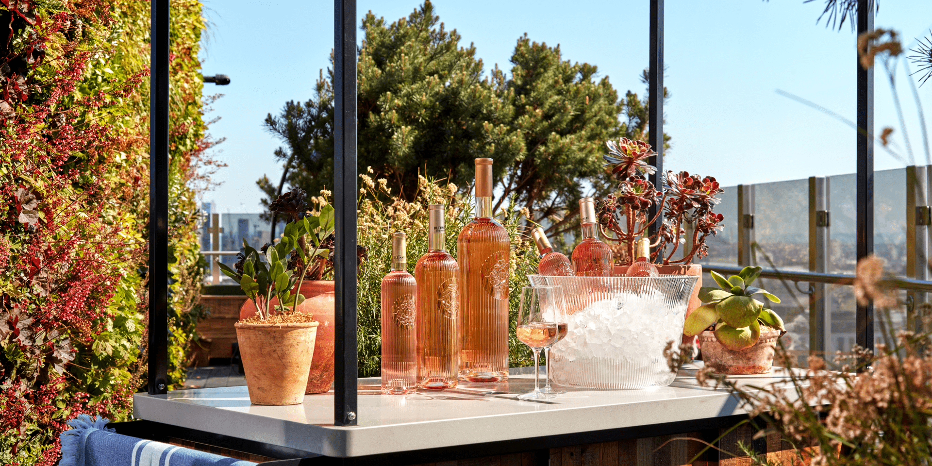 Outside bar with bottles of wine and a bucket of ice