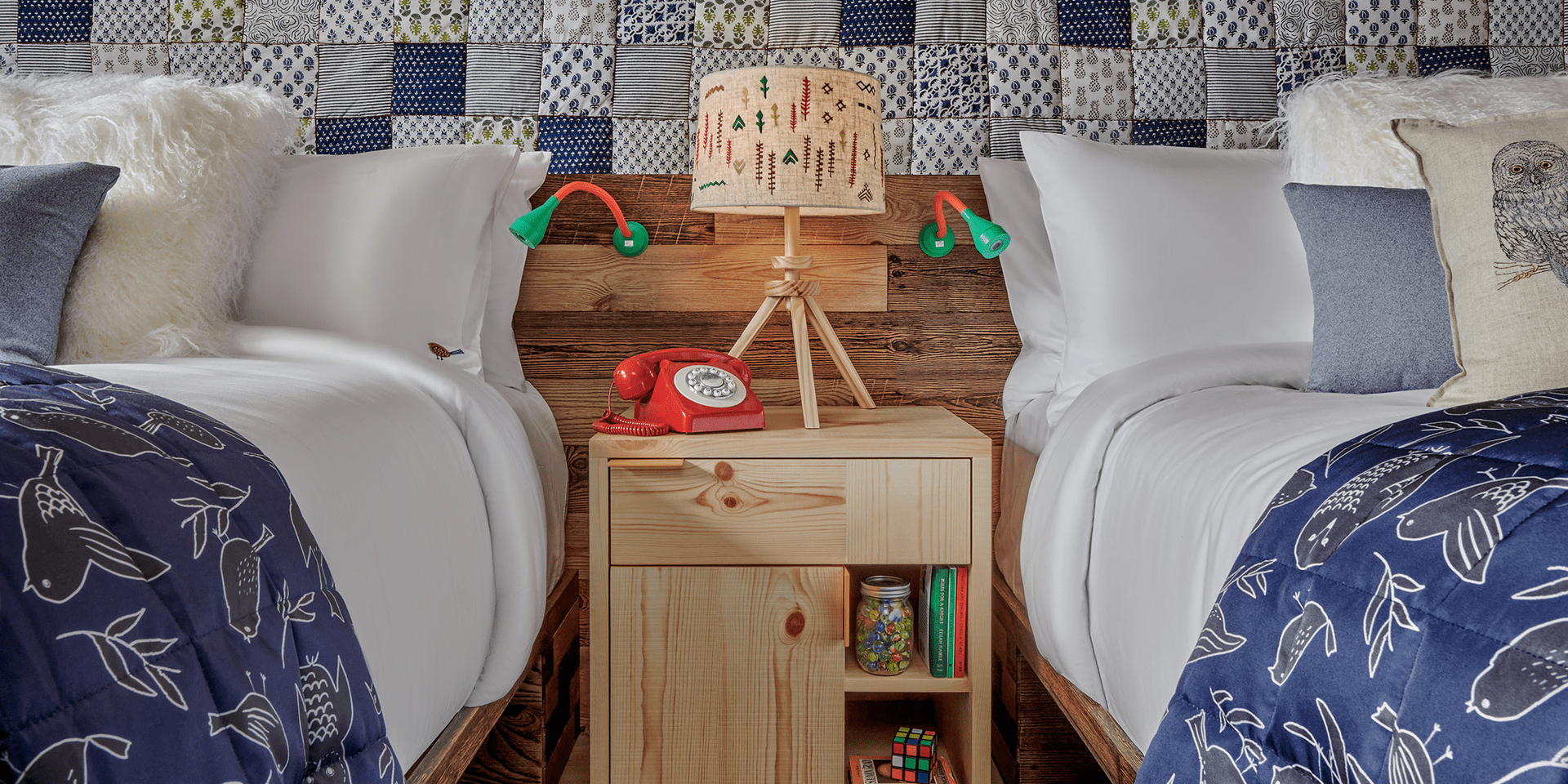 hotel room with two beds that share a nightside table