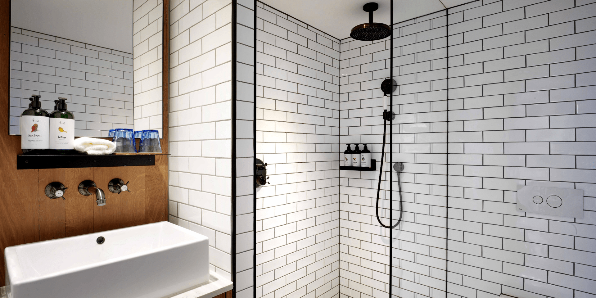 bathrrom with walk-in shower and small vanity