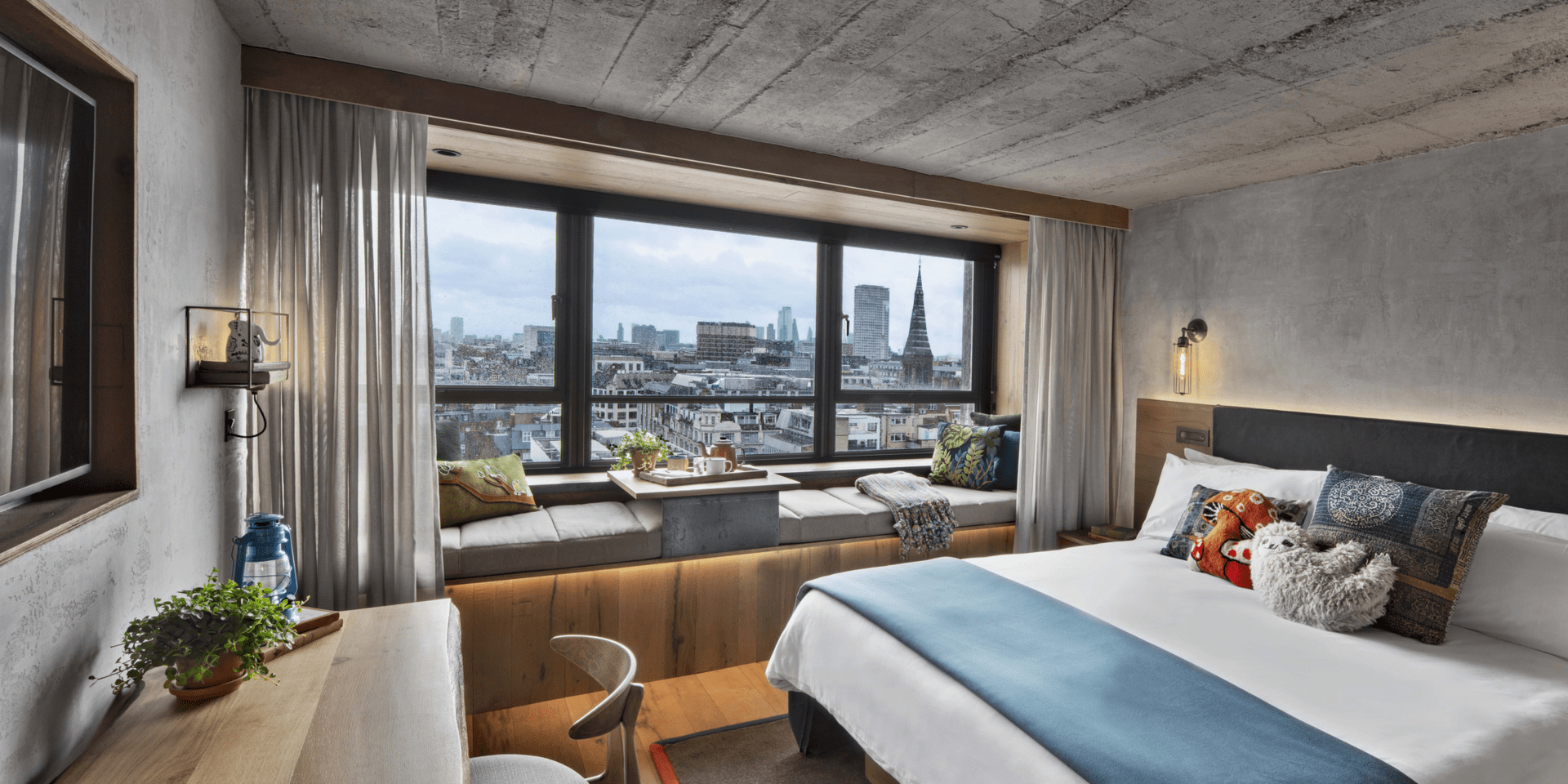 hotel room with king bed and wood desk