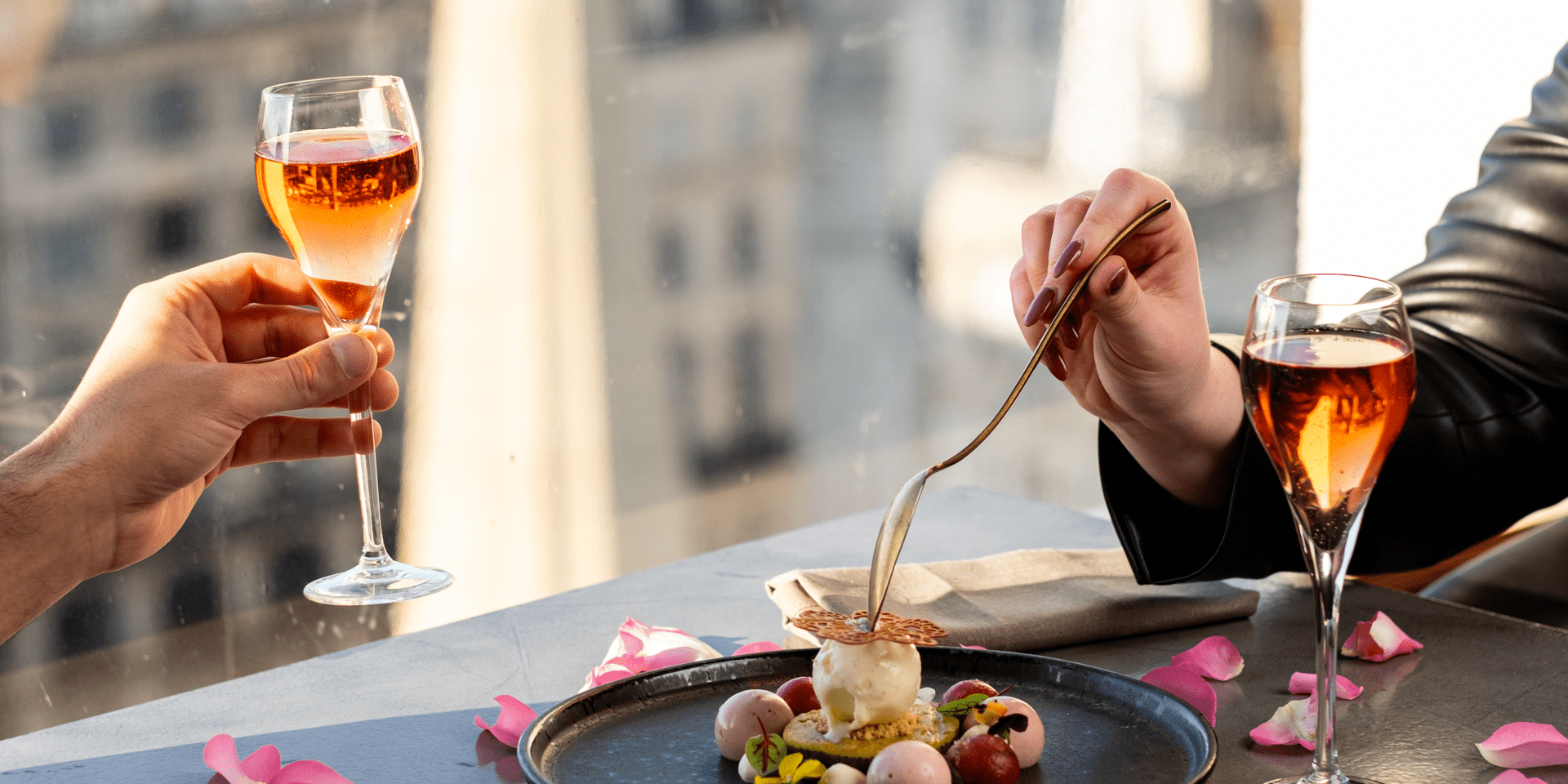 people enjoying a valentine's date dessert and drinking champagne