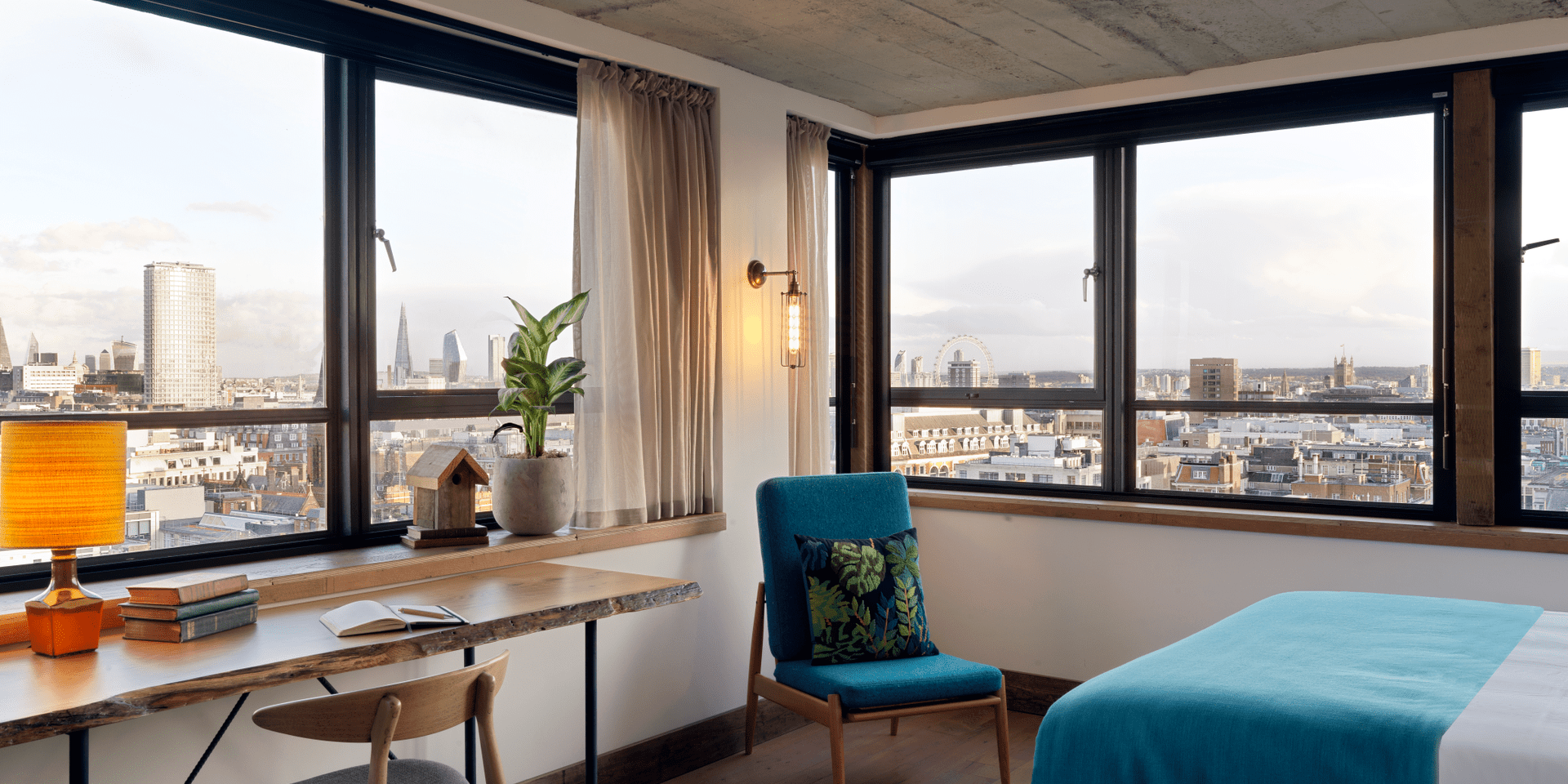 hotel room with workspace and small chair