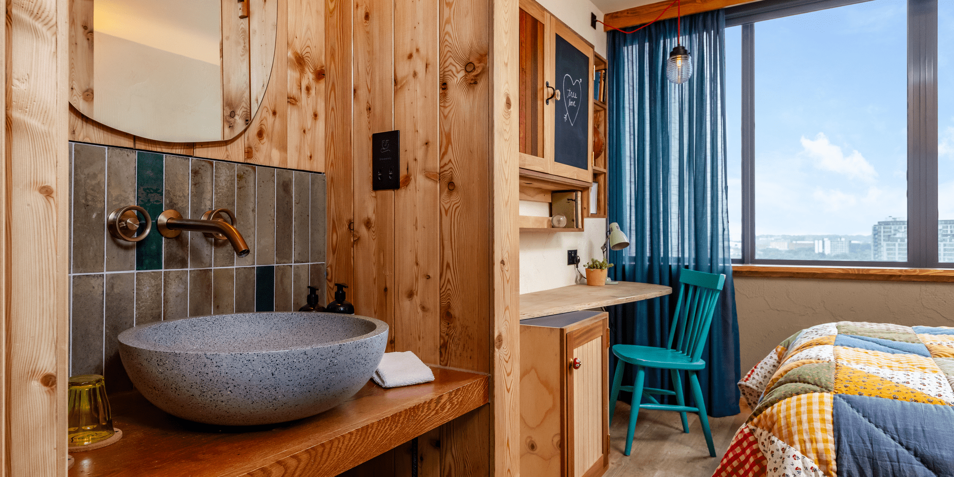 Hotel room with a vanity, bed, and chair