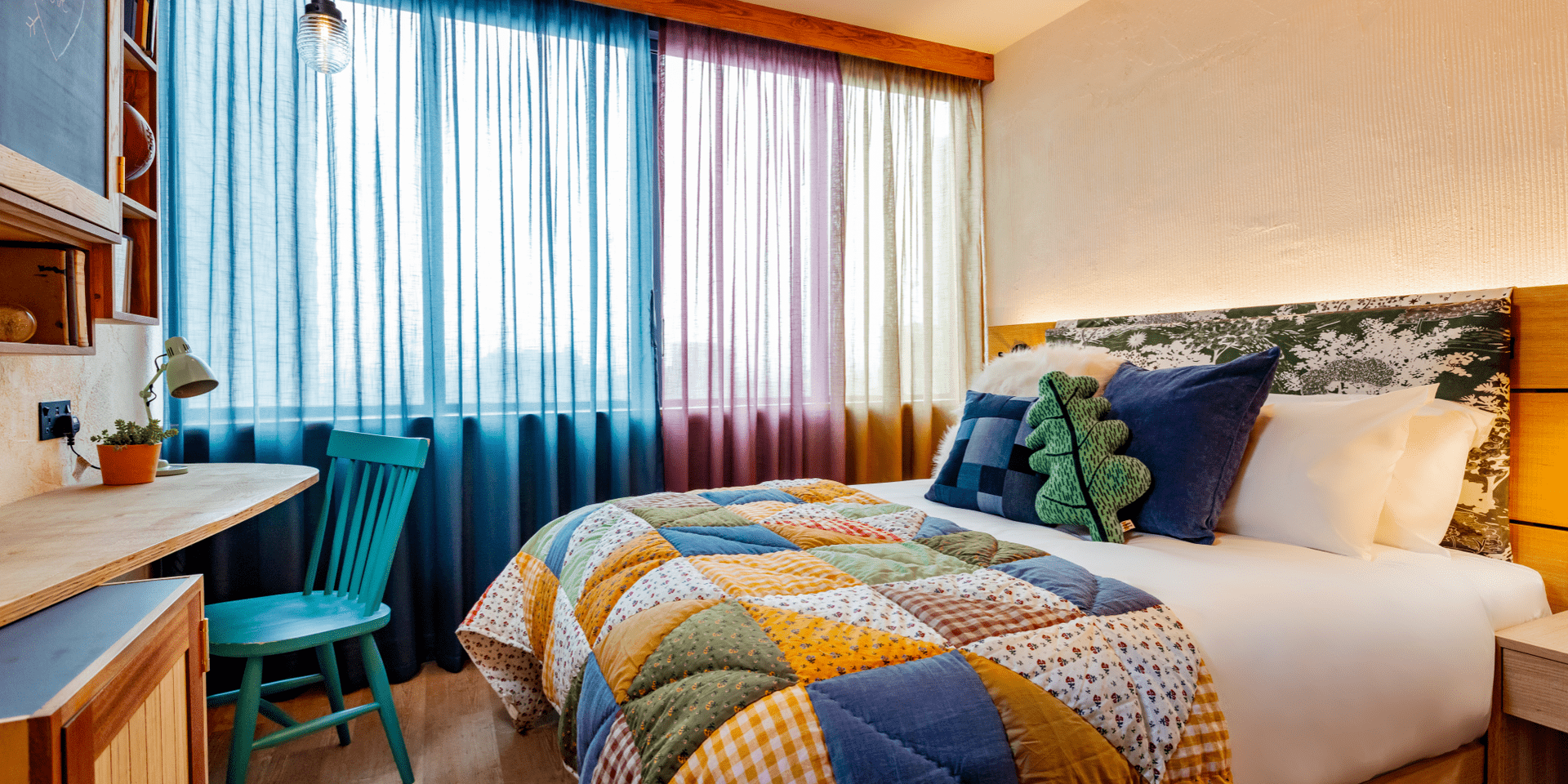hotel room with bed and small desk