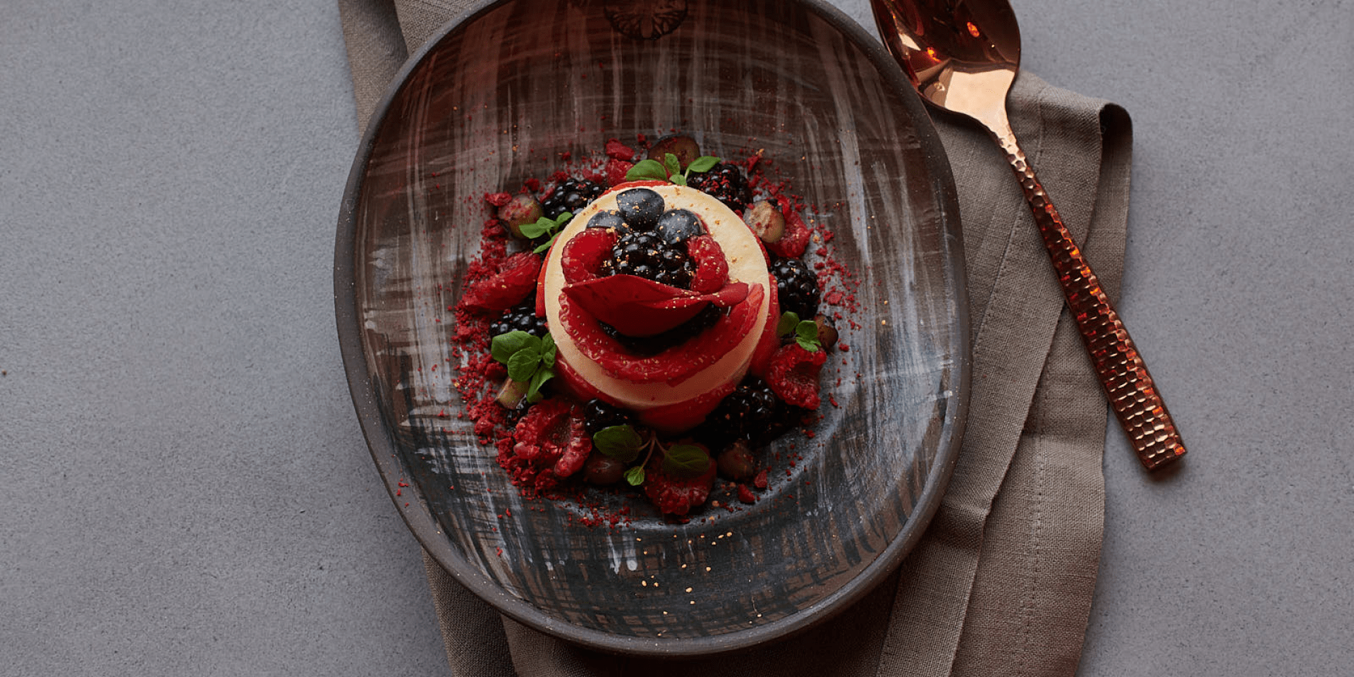 A desset with berry garnish.