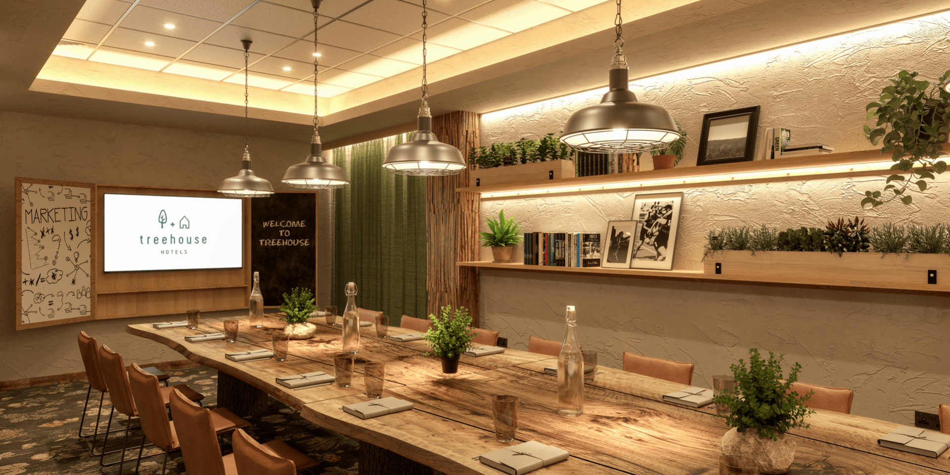 The Chestnut space at Treehouse Manchester, a warmly lit board room with greenery touches.