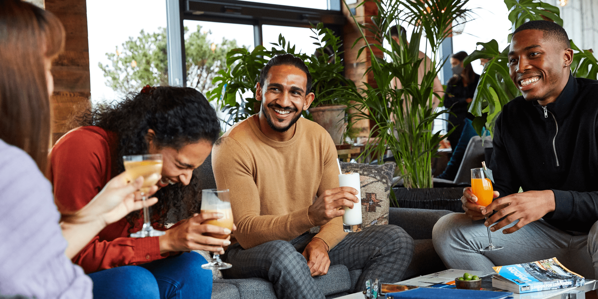 A group of friends laughing together at Madera