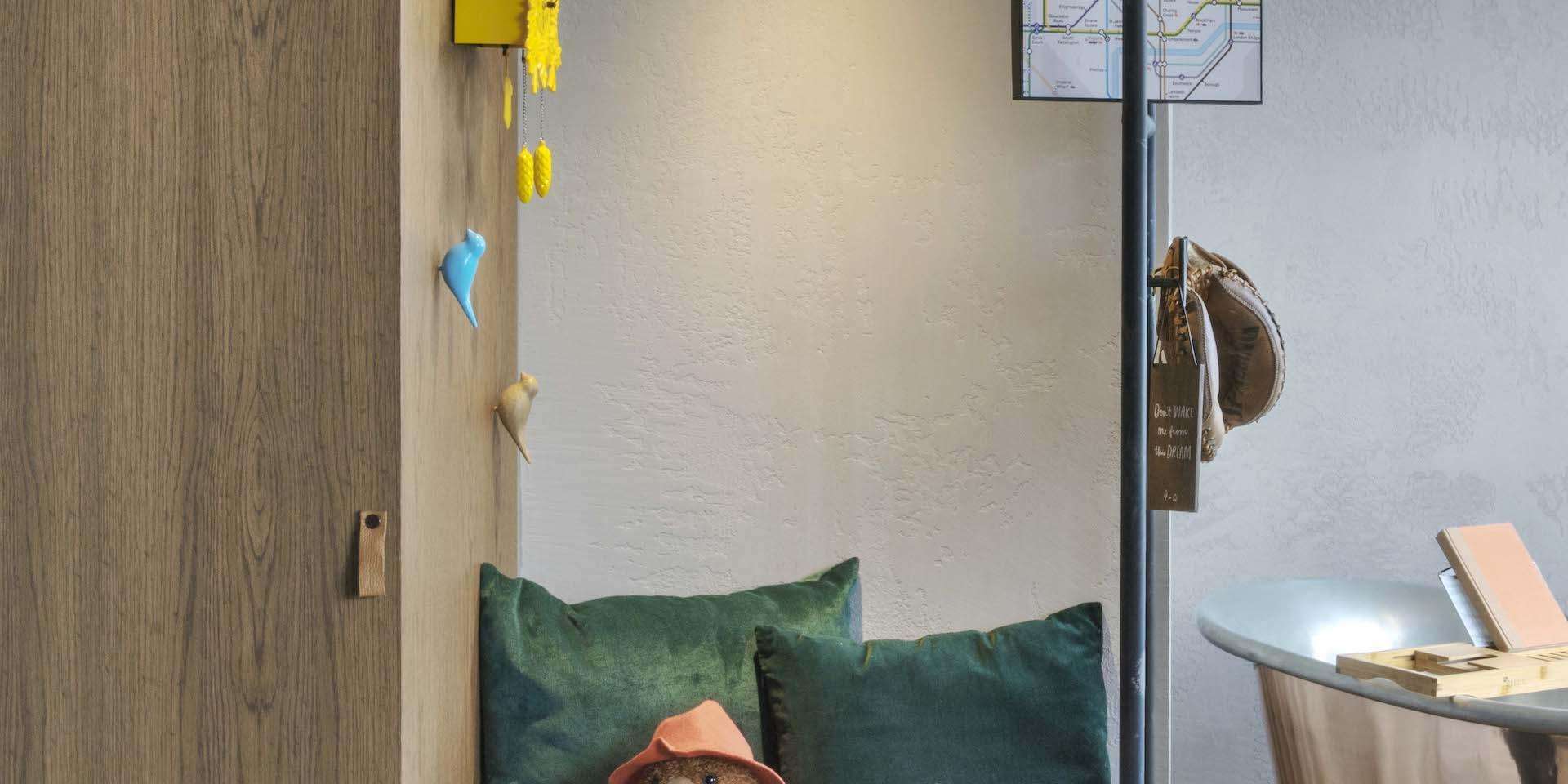 Paddington Bear resting on a bench