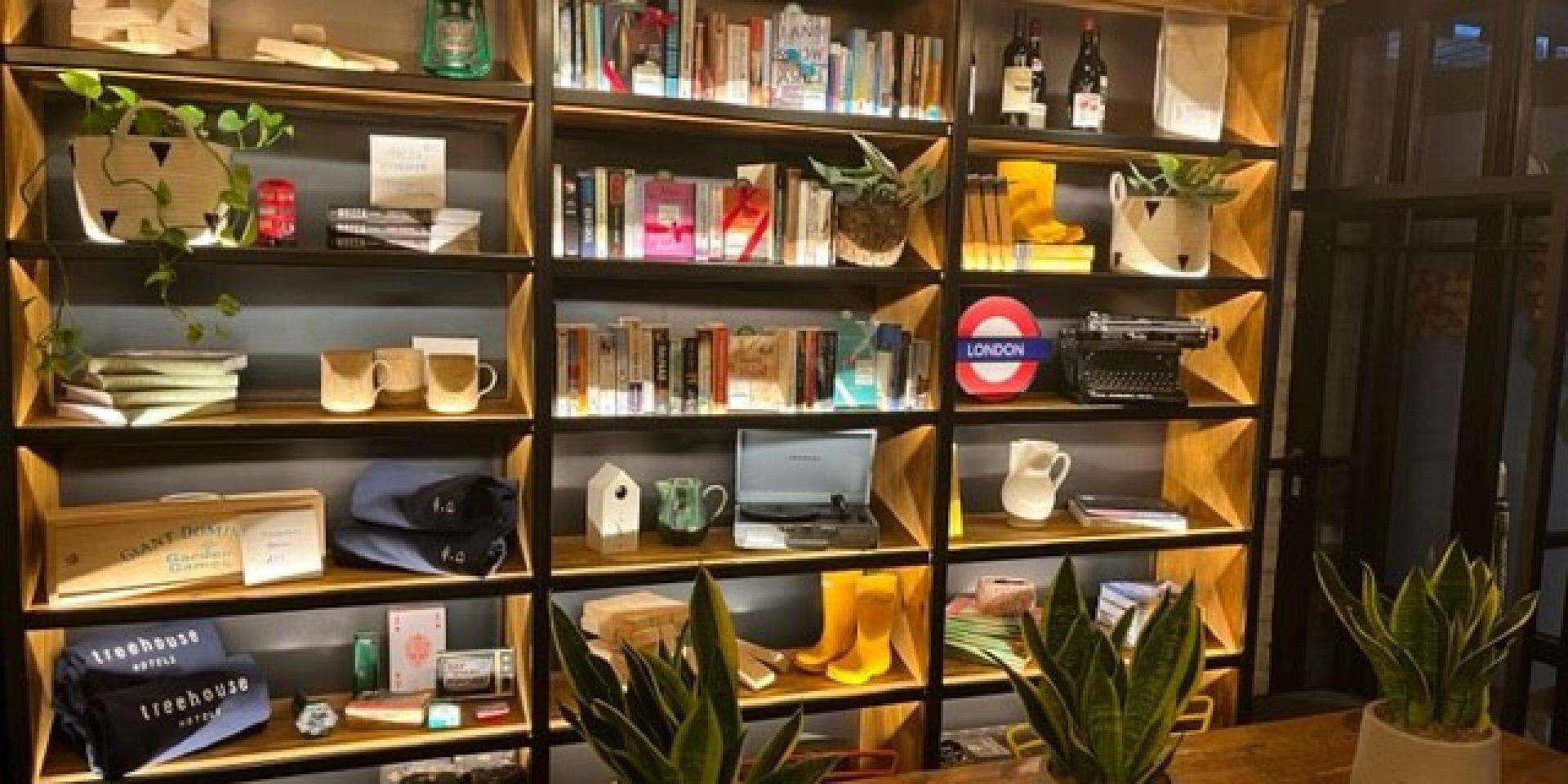 A wall of shelves with books on the shelves