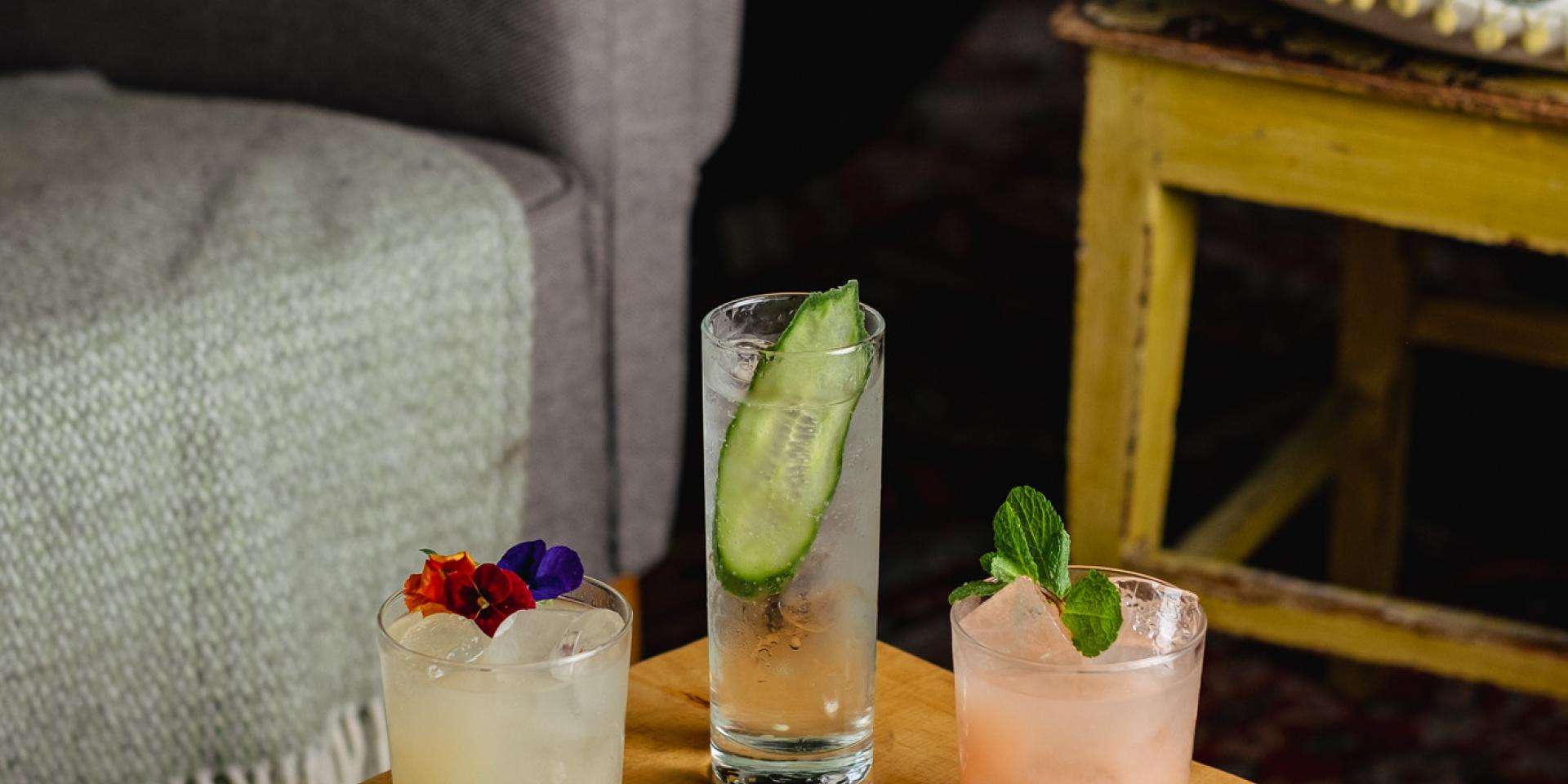 3 cocktails on a wood table