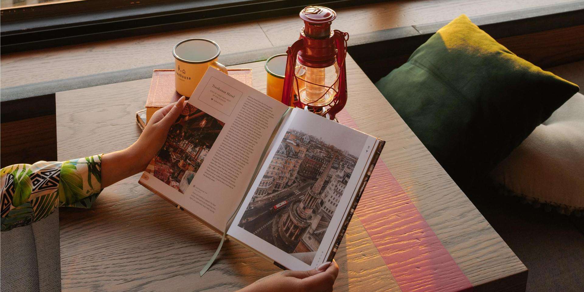 Woman reading Pretty Little London book