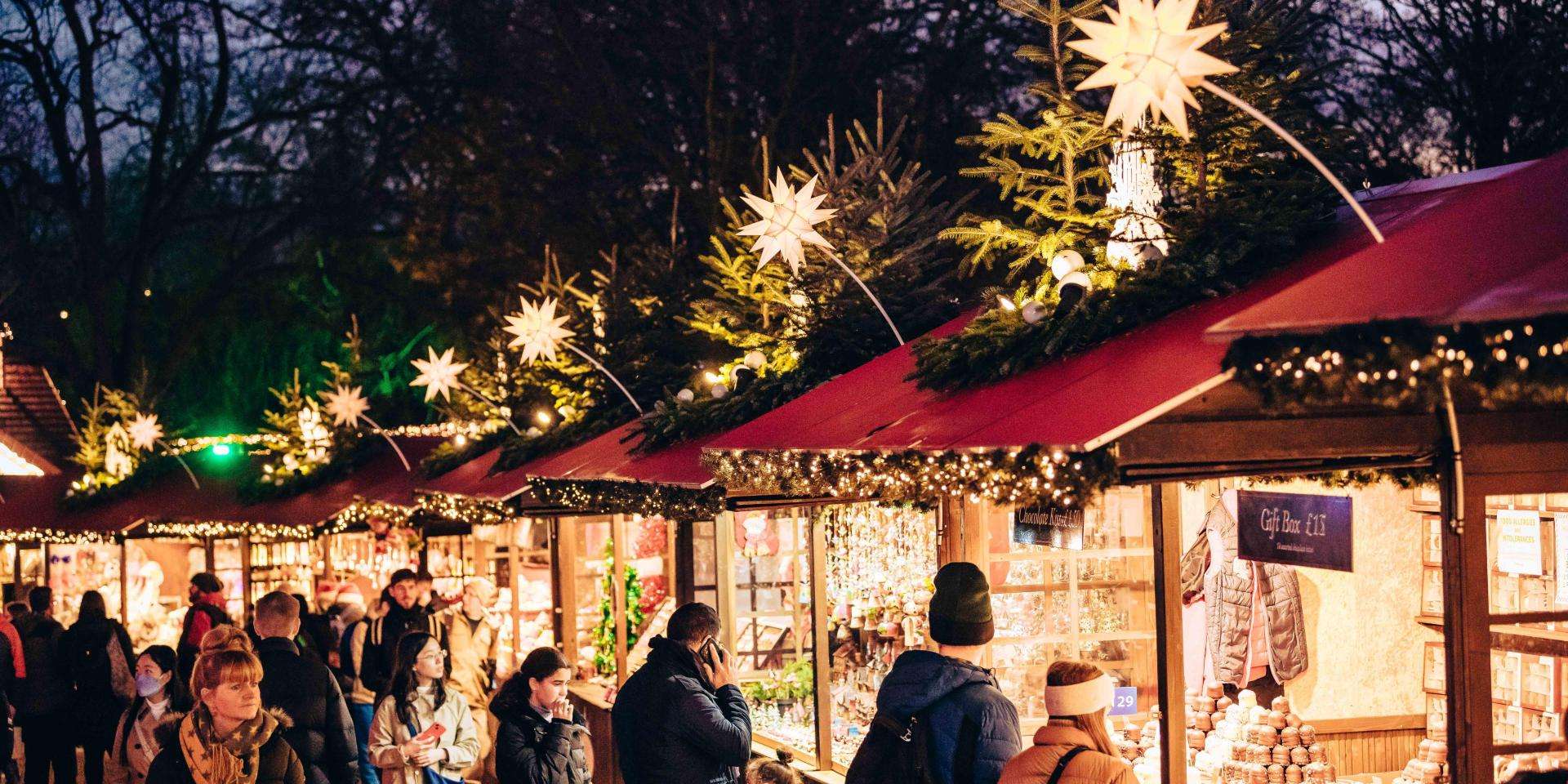 people at a Christmas market at night