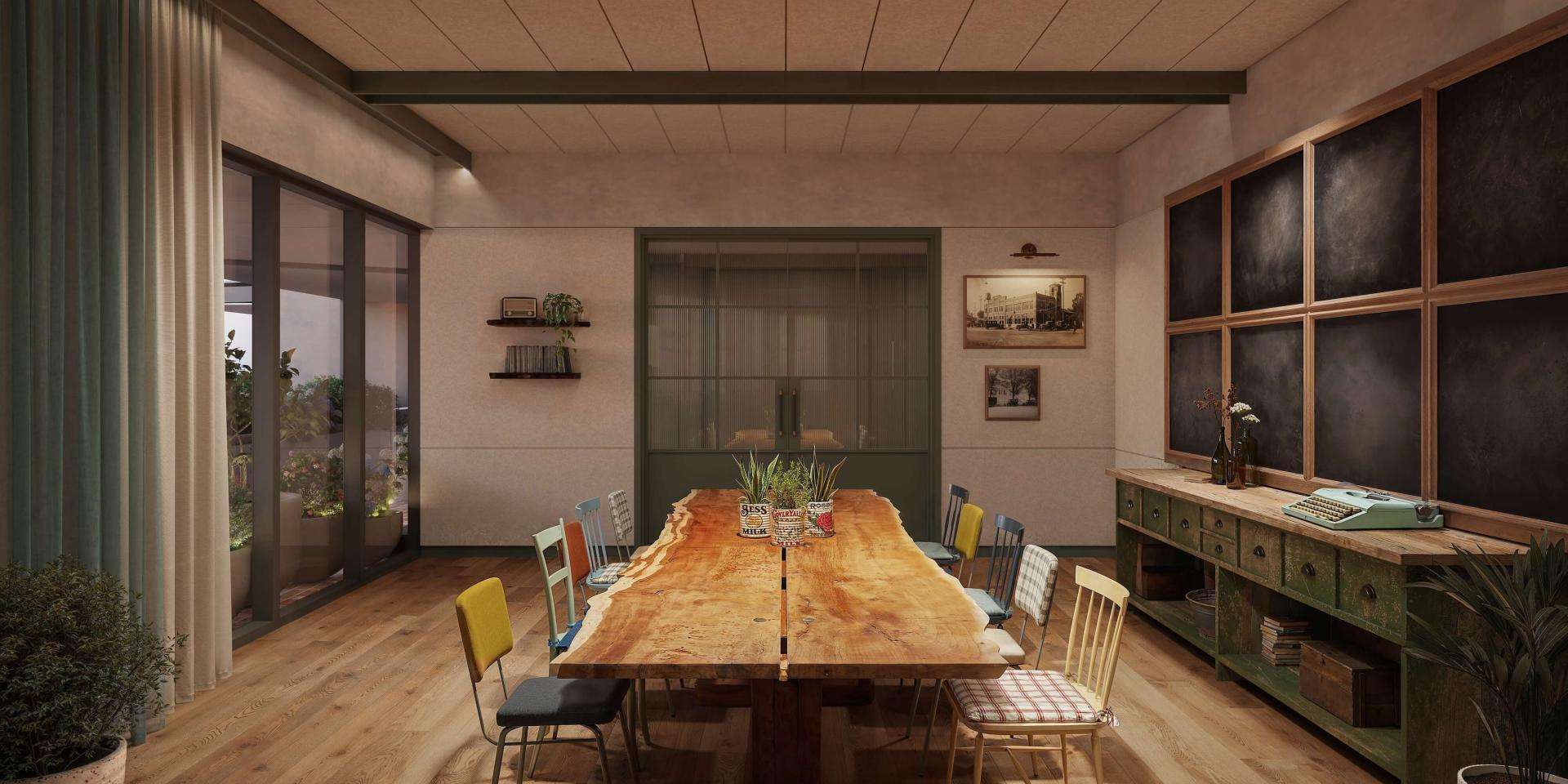 A meeting room featuring wooden floors and a large wooden table